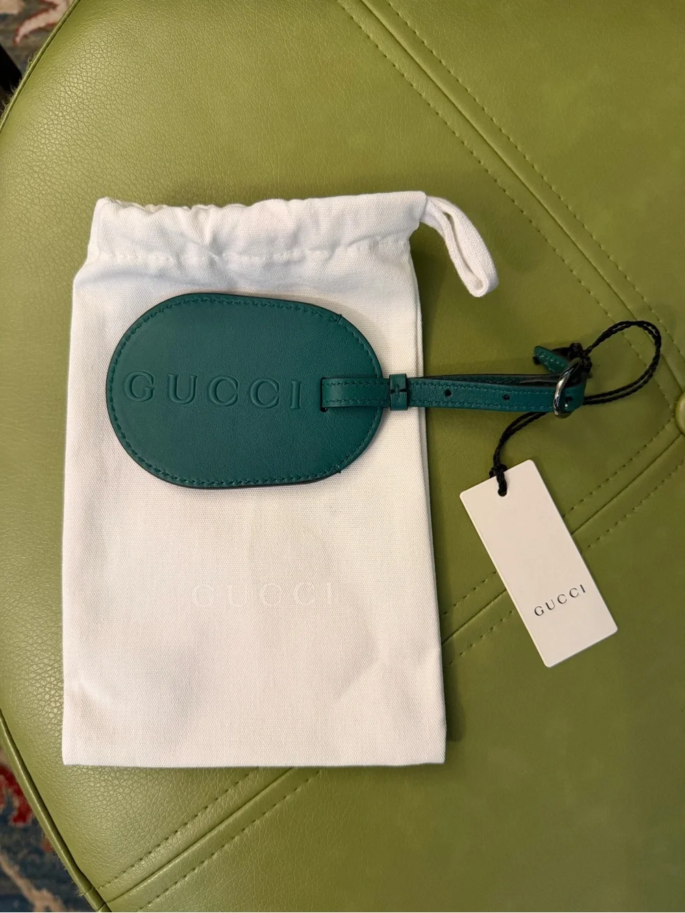 NWT Gucci Oval Leather Luggage Tag with Embossed Logo